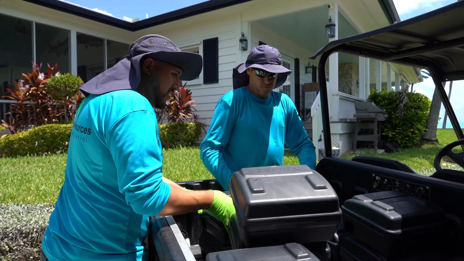 Natural Resources team preparing equipment outside a Miami home
